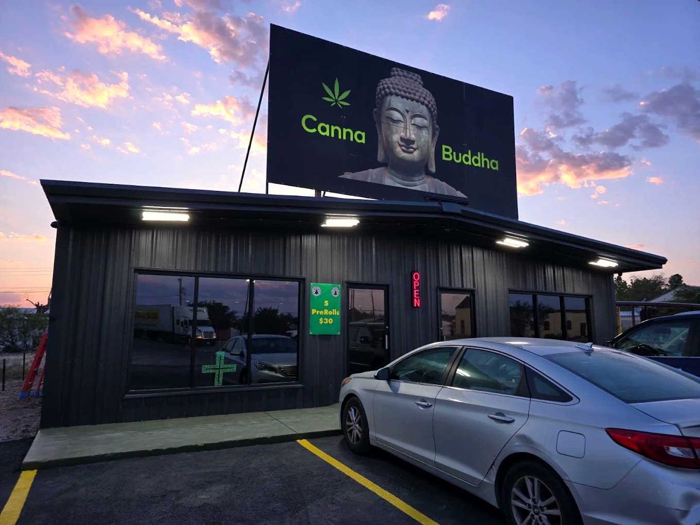 Canna Buddha Jal storefront billboard at dusk